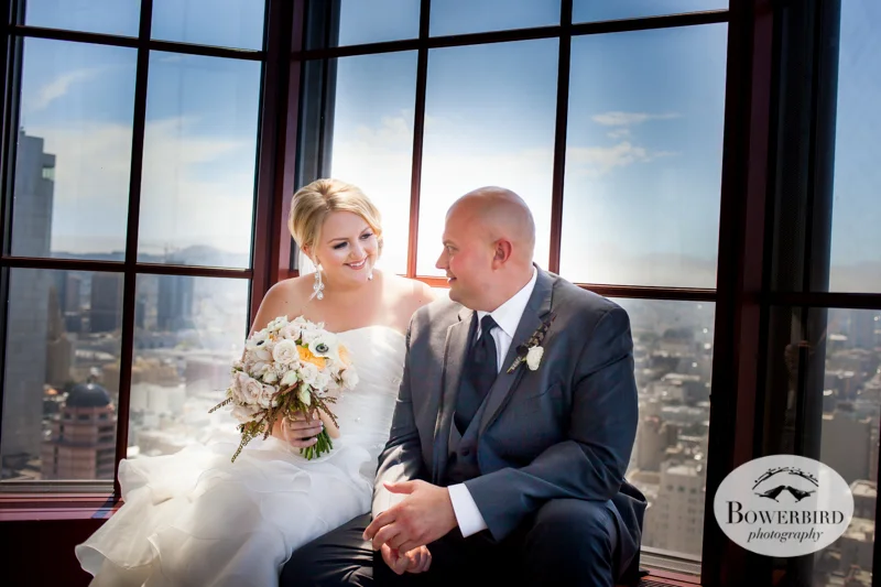 The bride and groom take a break on the window sill at Alexandra's, Westin St. Francis © 2014 Bowerbird Photography