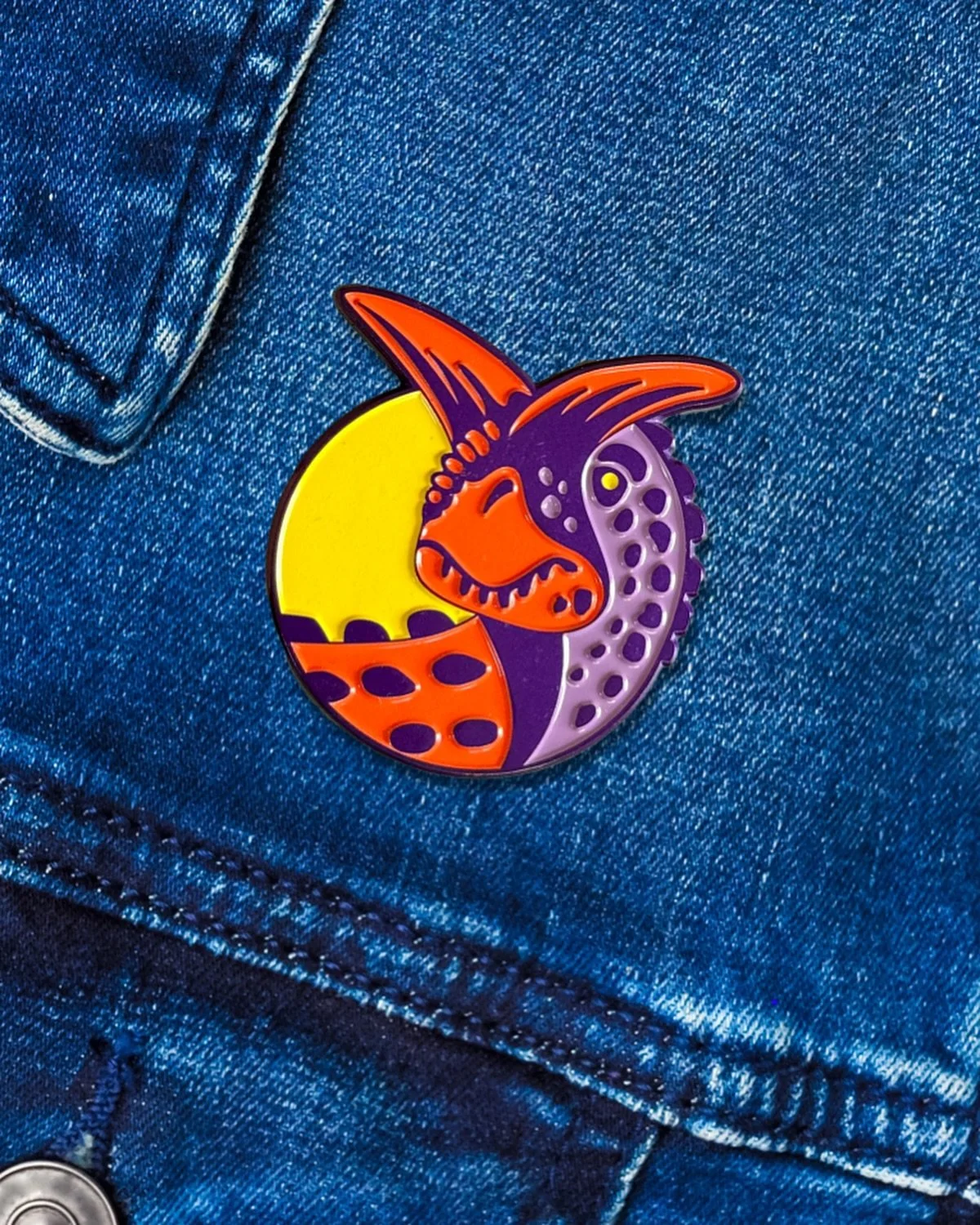 My first (and possibly last?) enamel pin is now available in my shop. 

After many years of flirting with the idea of making an enamel pin, I finally pulled it off with this toothy Carnotaurus in time for convention season. It was a popular choice th