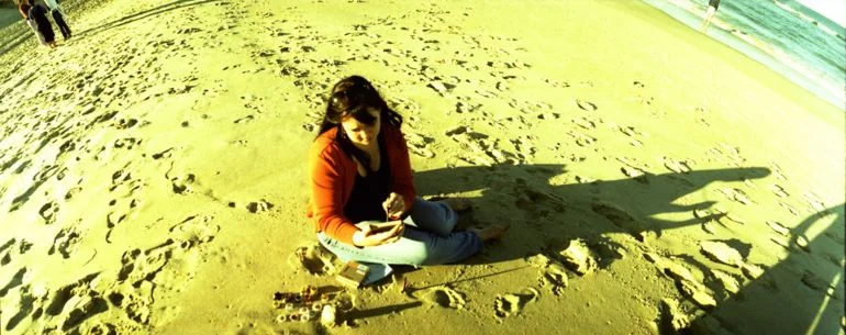 Jolie paints on the beach in the Outer Banks