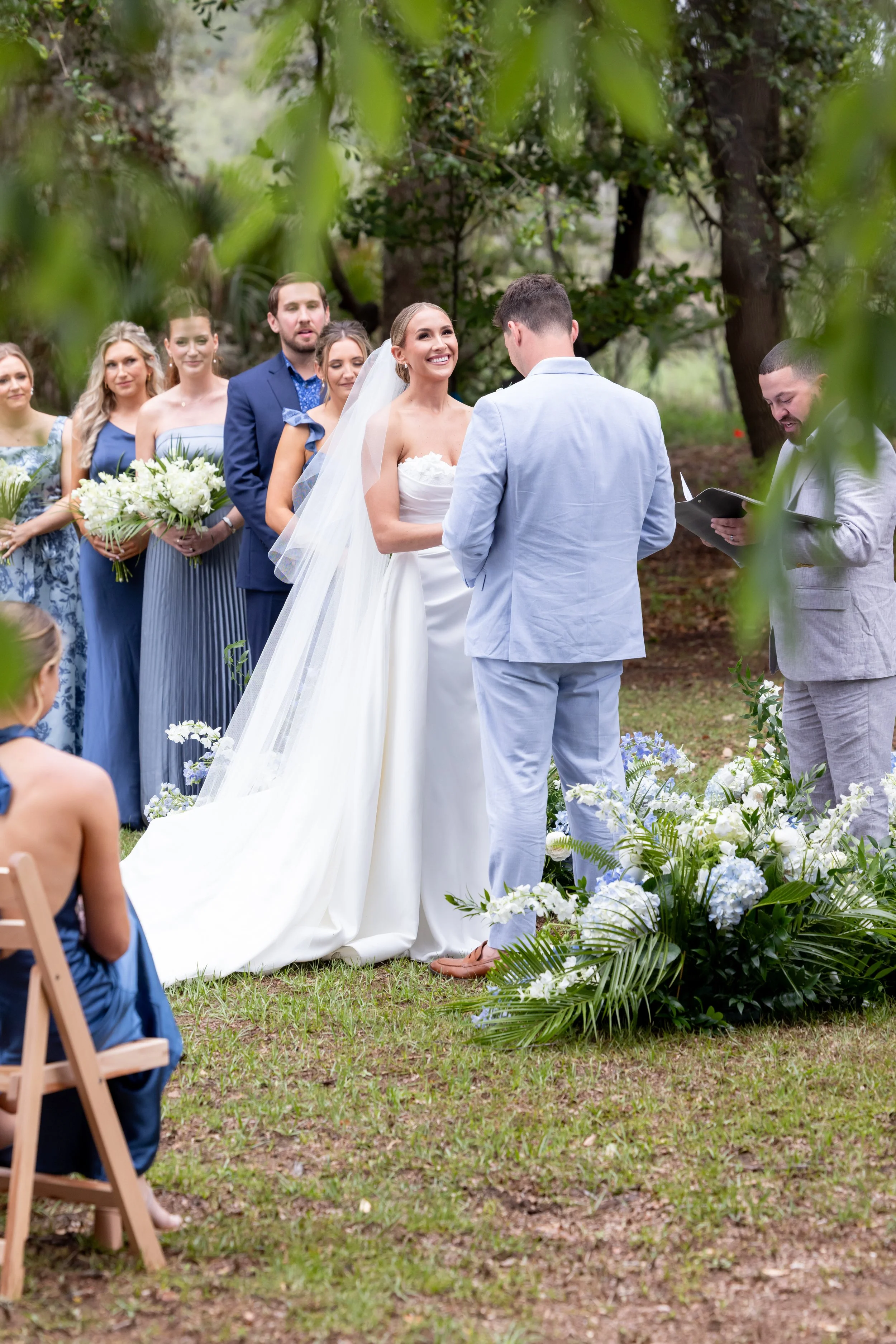 bride and groom exchanging vows outdoors