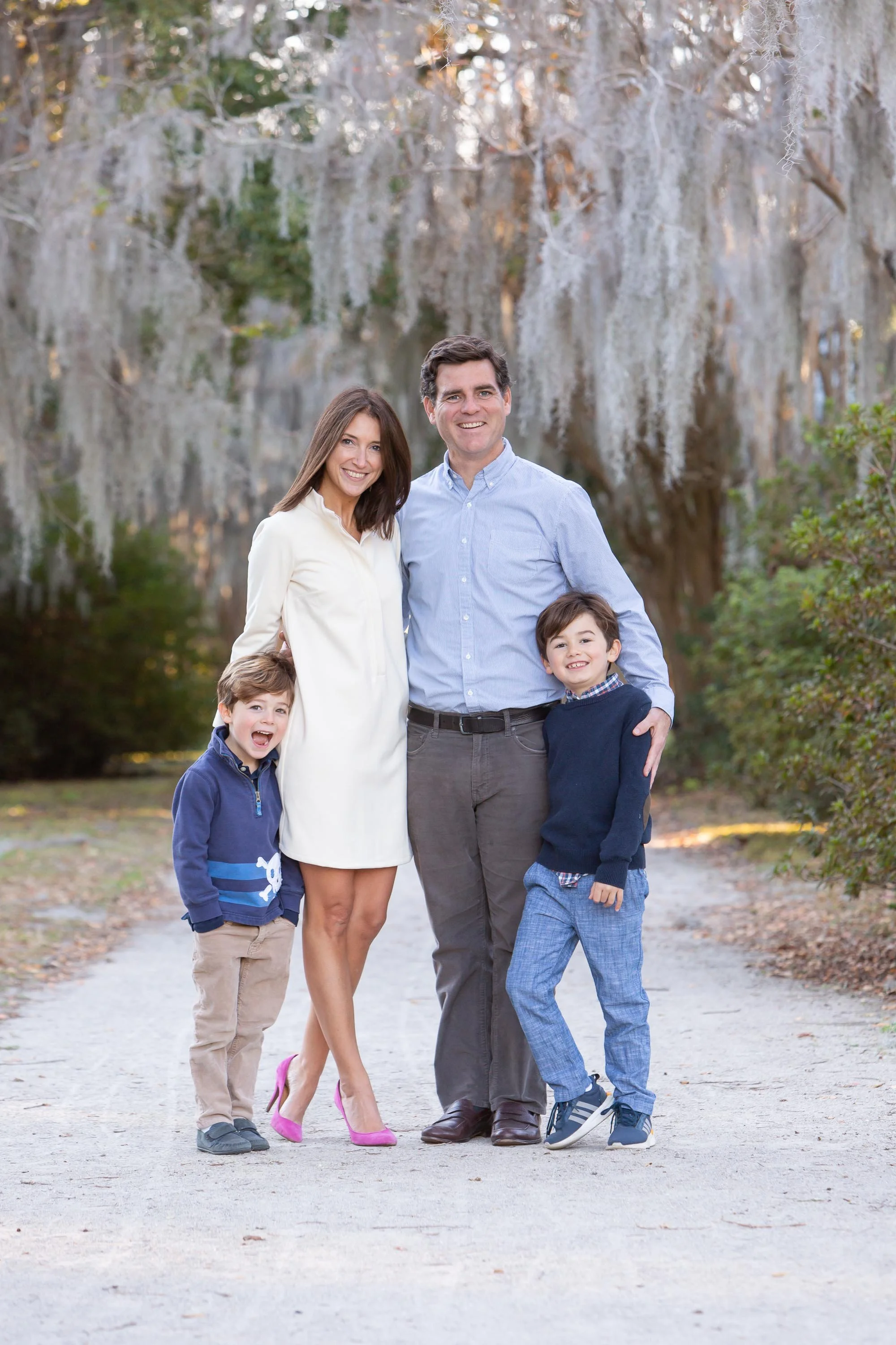 family of four portrait under southern moss