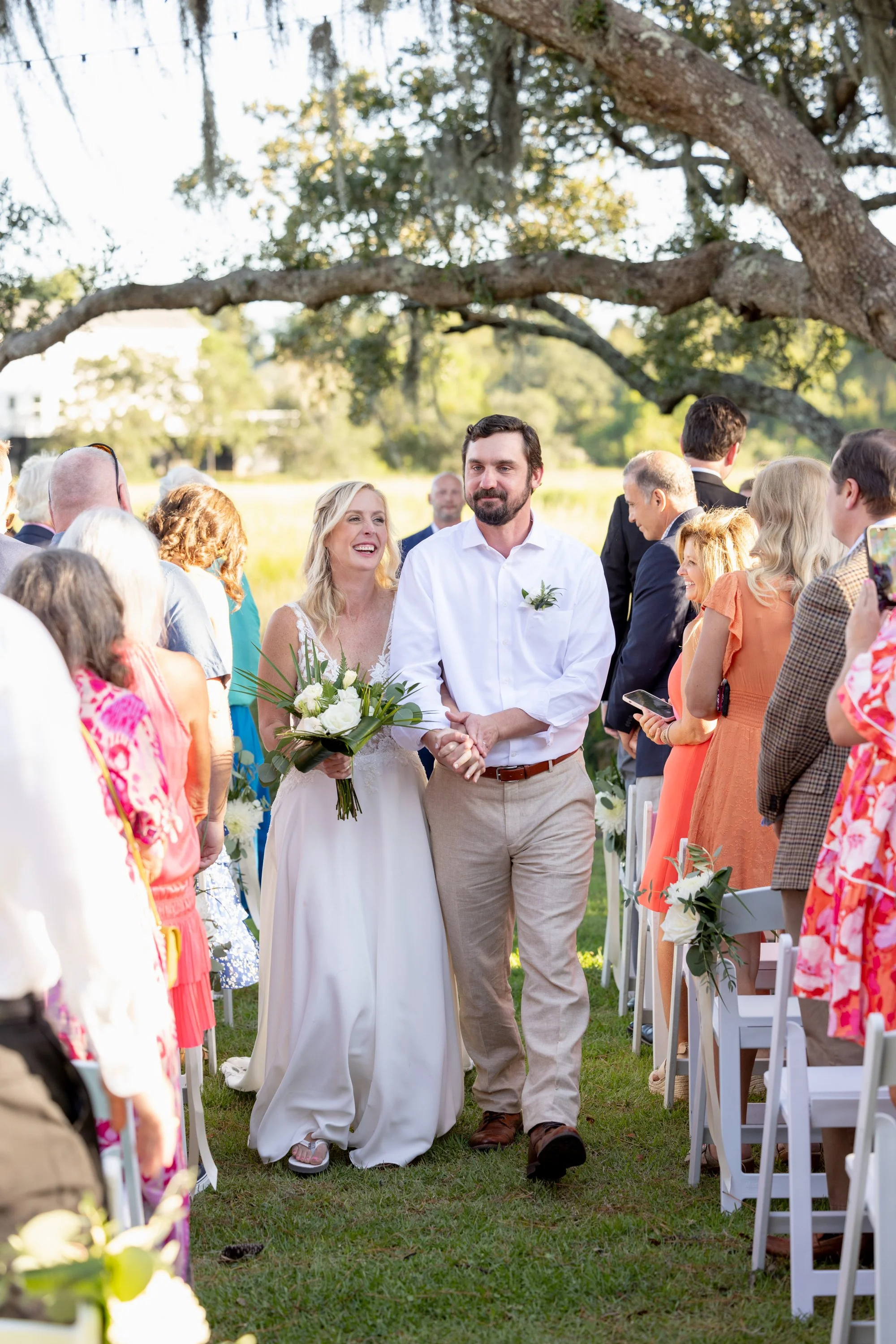 candid lowcountry photographers of couple recessional