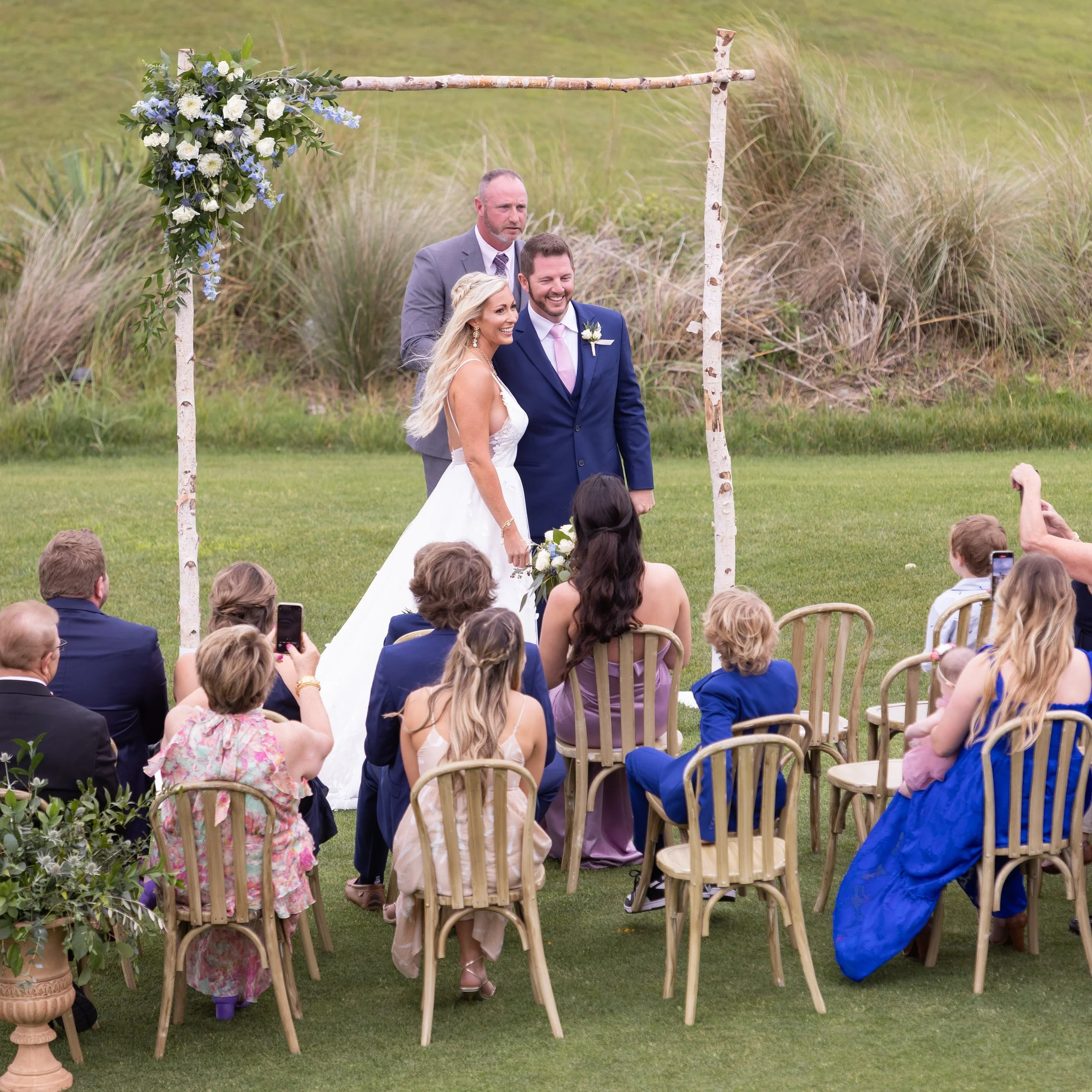 wedding couple facing guests after vows