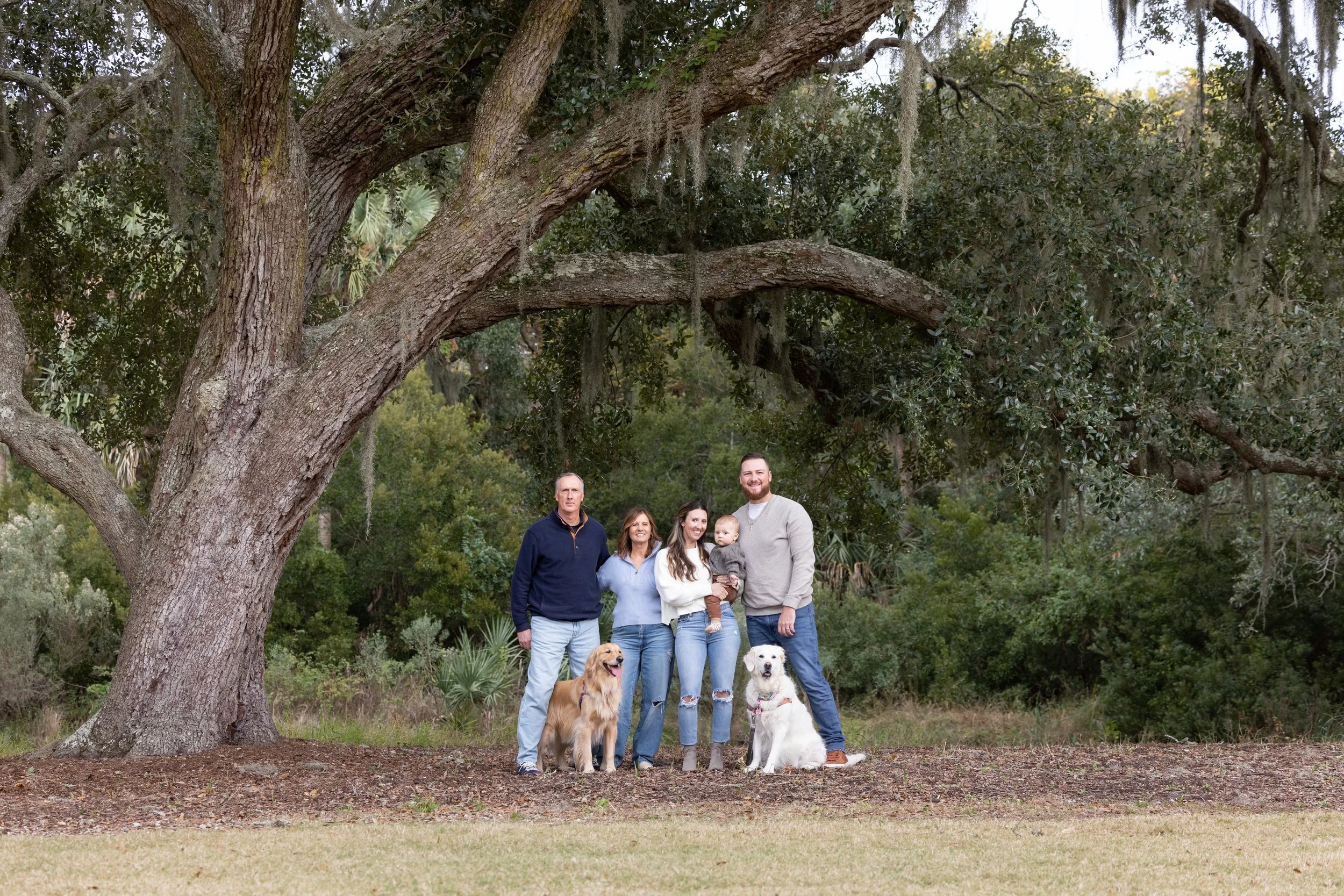 casual family portrait under the oaks
