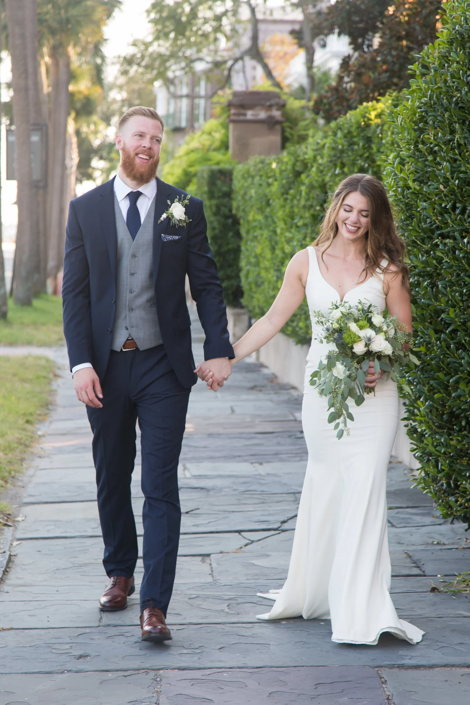 bride and groom candid walking Charleston