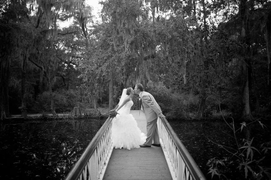 black-white-couple-kissing-on-bridge.jpg