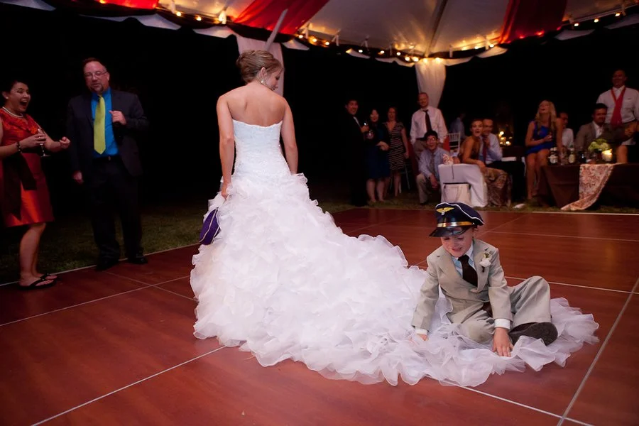 bride-giving-ring-bearer-a-lift.jpg
