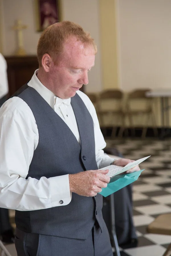 groom-reading-letter.jpg