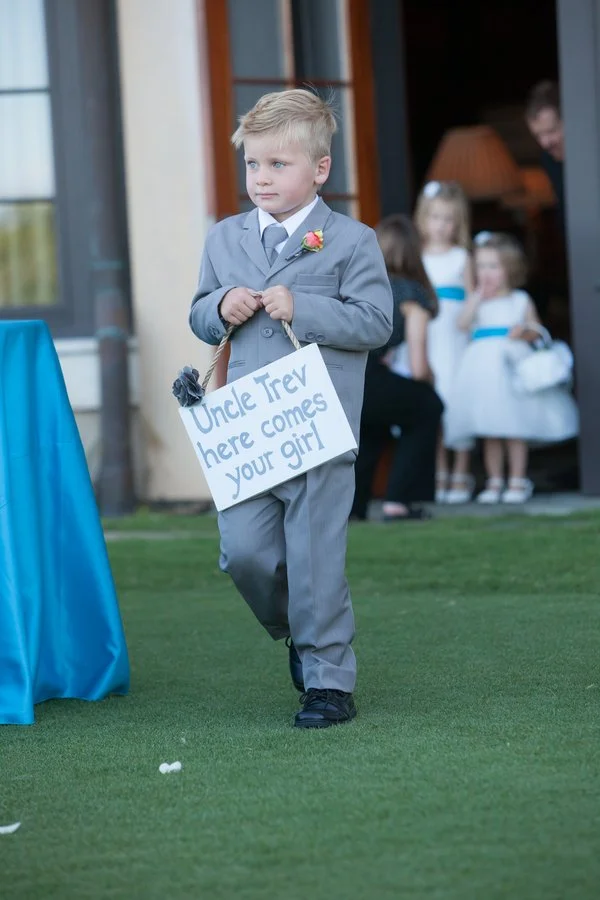 ring-bearer-with-signage.jpg