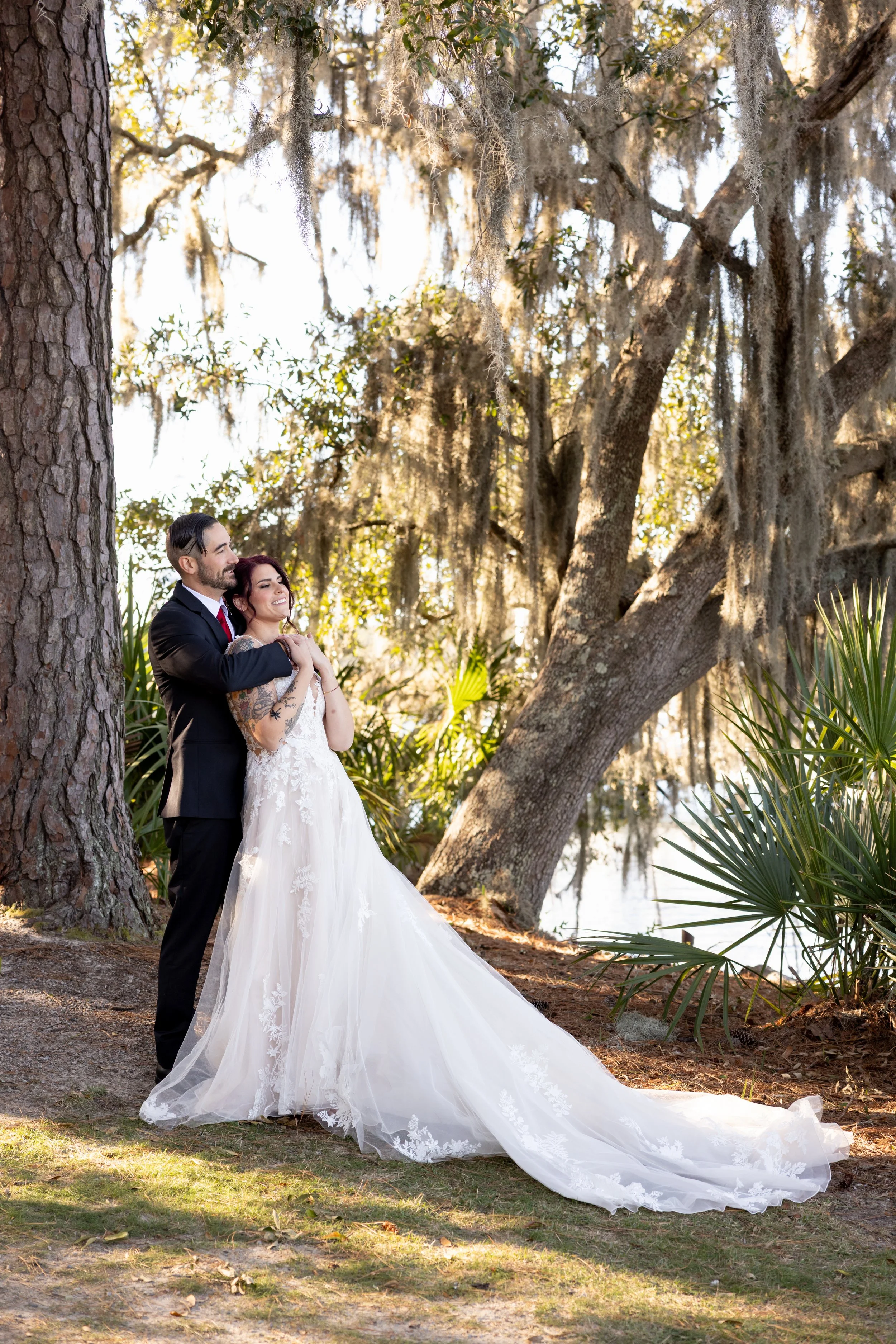 couple embracing in the trees
