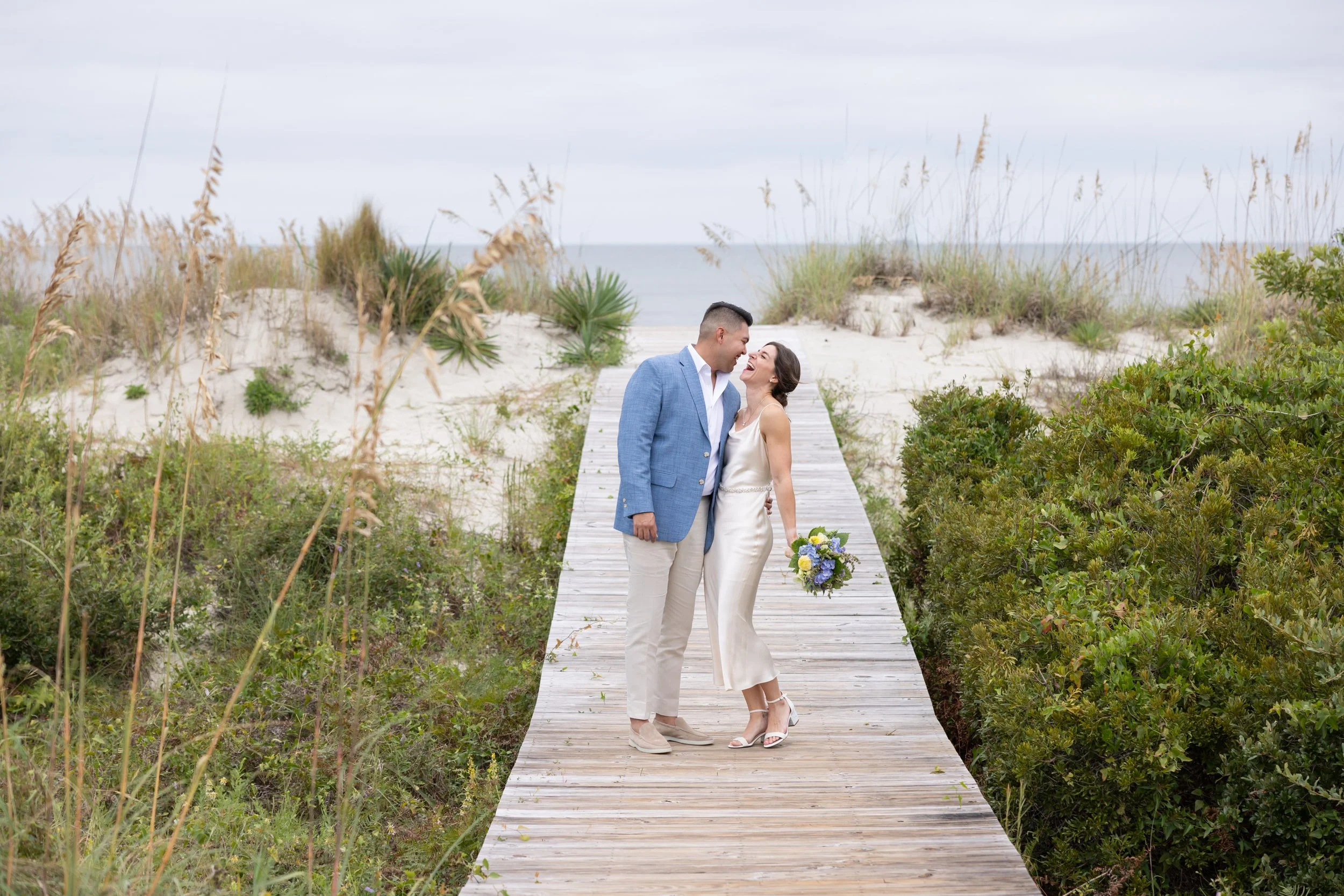just-eloped-couple-about-to-kiss-beachside