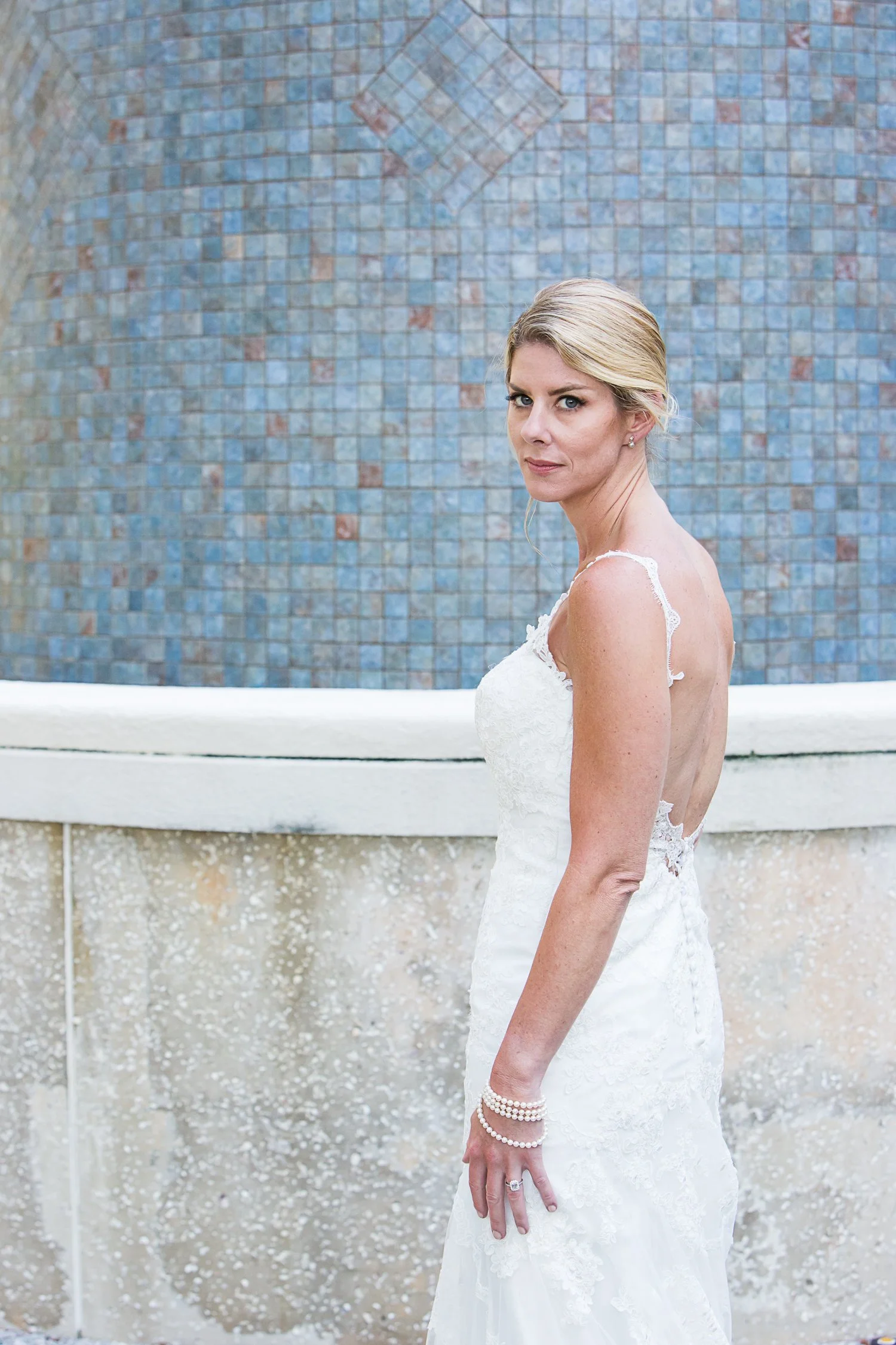 modern bride in front of blue tiles