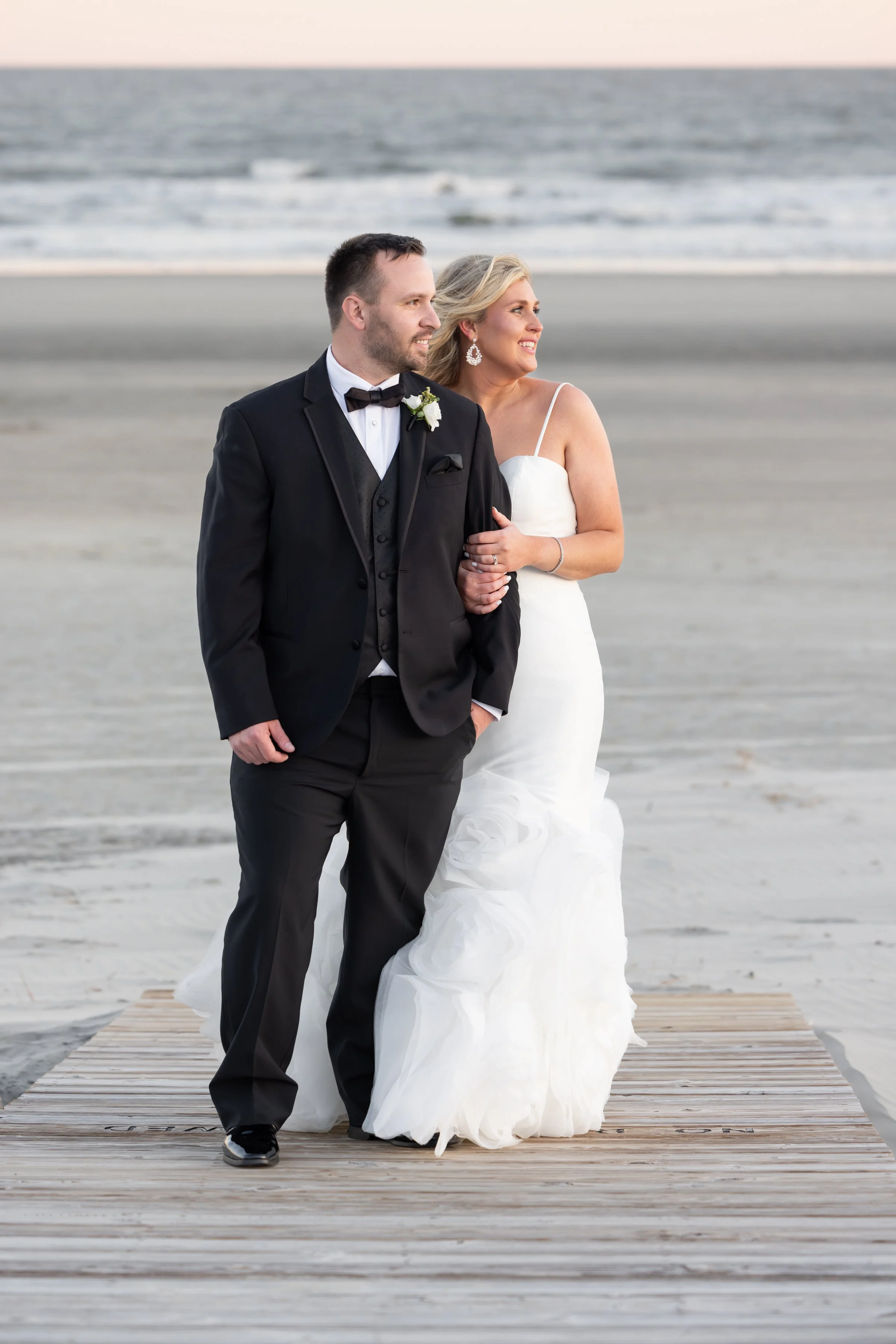 beach wedding couple on the boardwalk