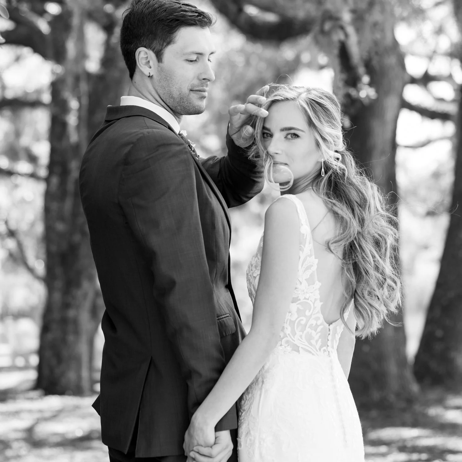tender candid moment between groom and bride
