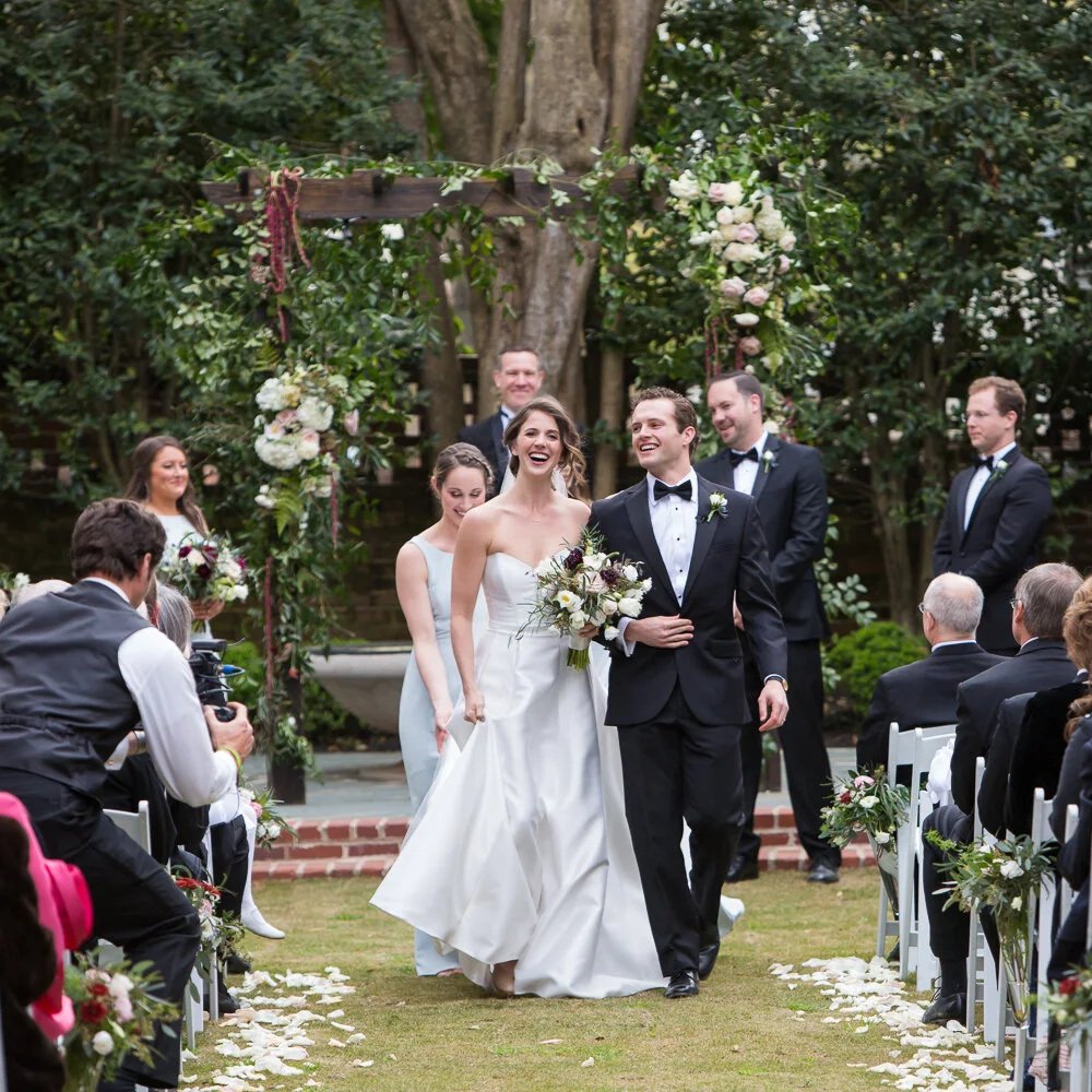 bride and groom recessing out of Lace House wedding ceremony