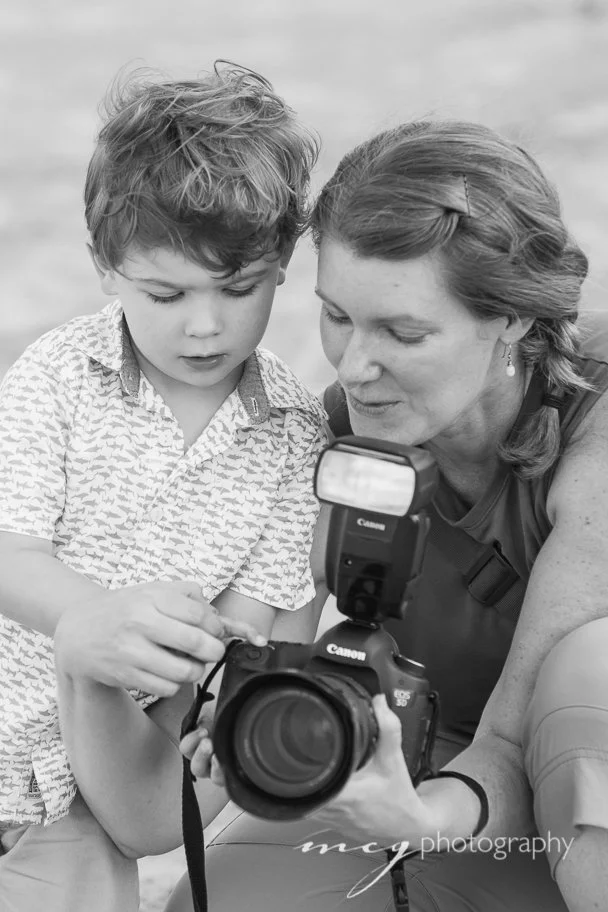 Corrie sharing her camera with little boy