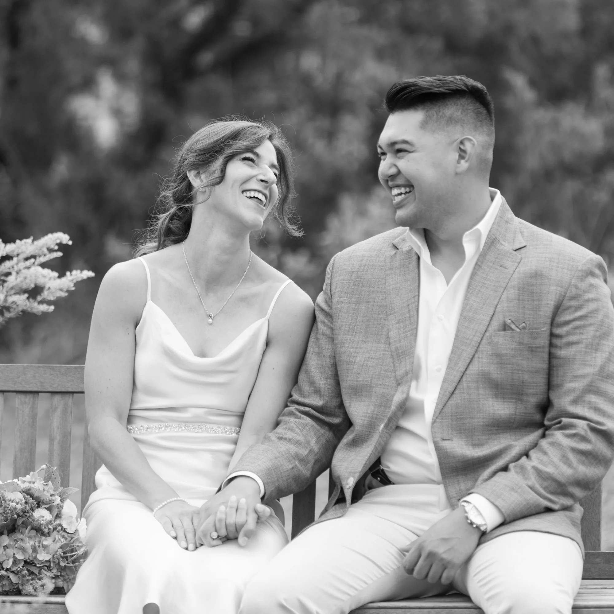 black and white candid of laughing eloping couple