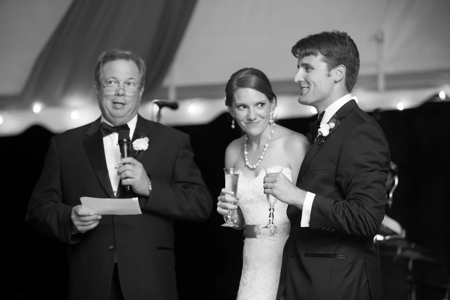 dad toasting bride and groom at wedding reception
