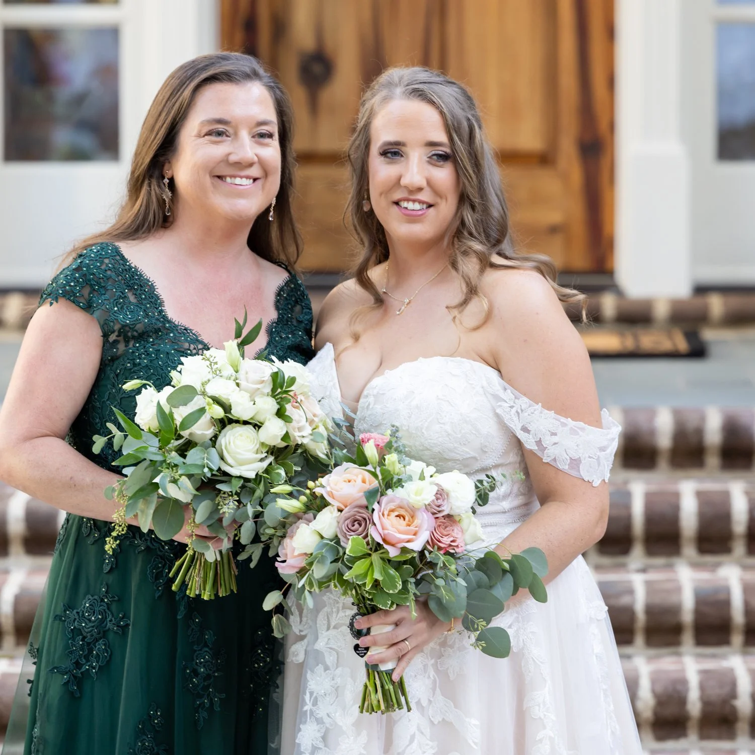 portrait of two brides and their bouquets