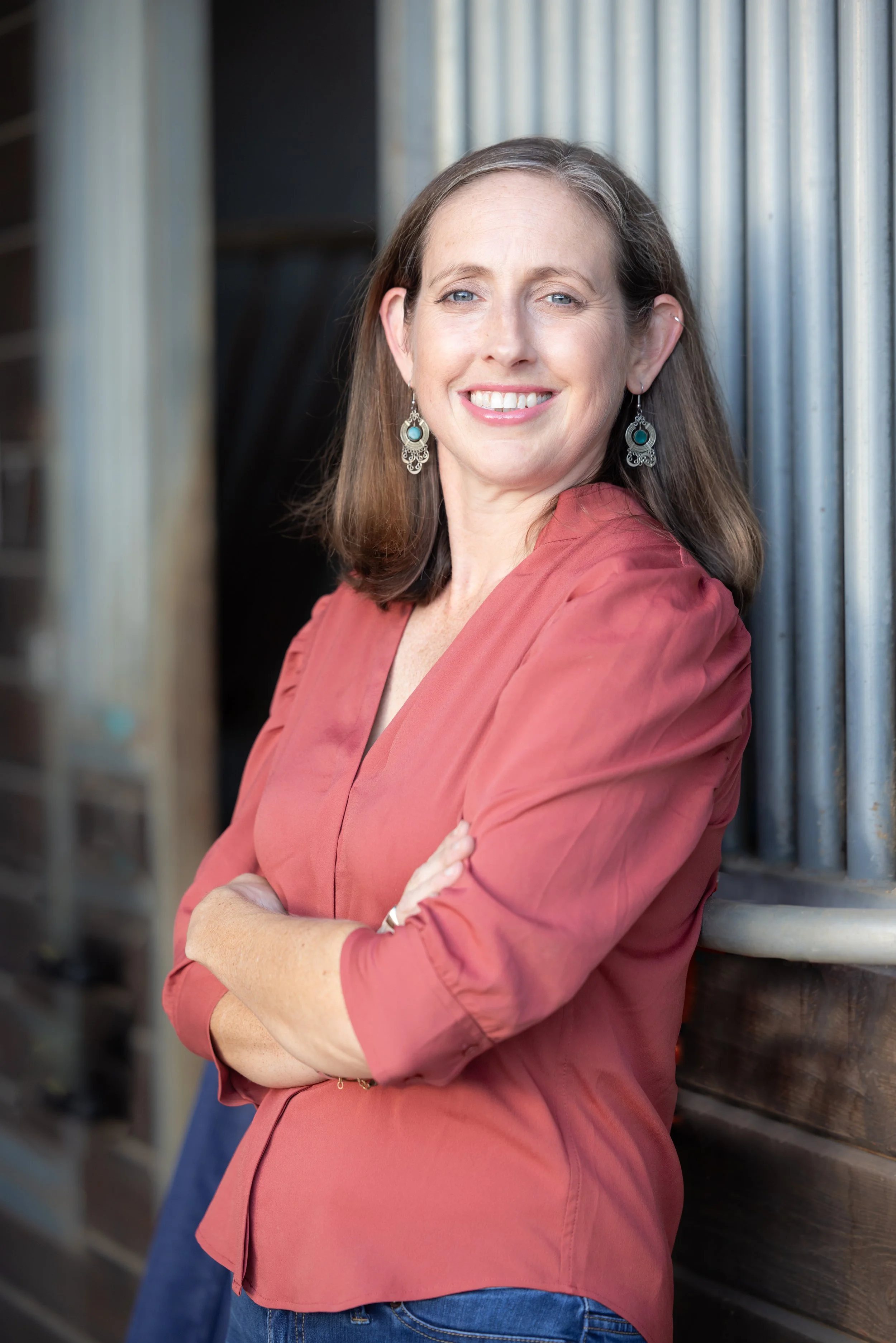 professional female veterinarian barn portrait