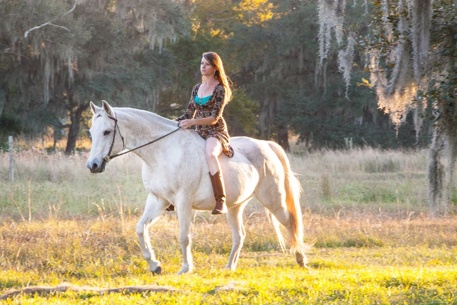 woman in dress riding bareback