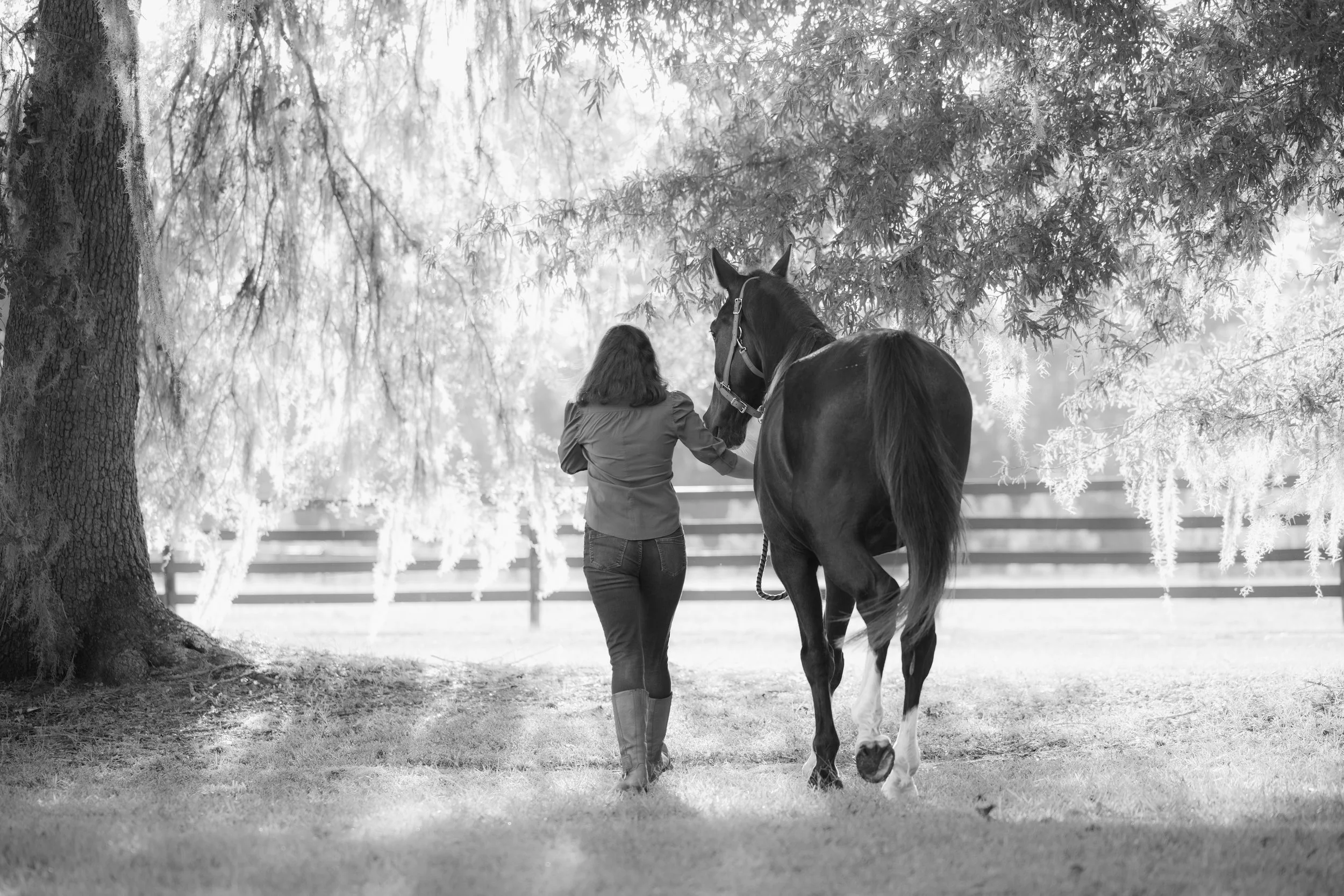 woman walking horse
