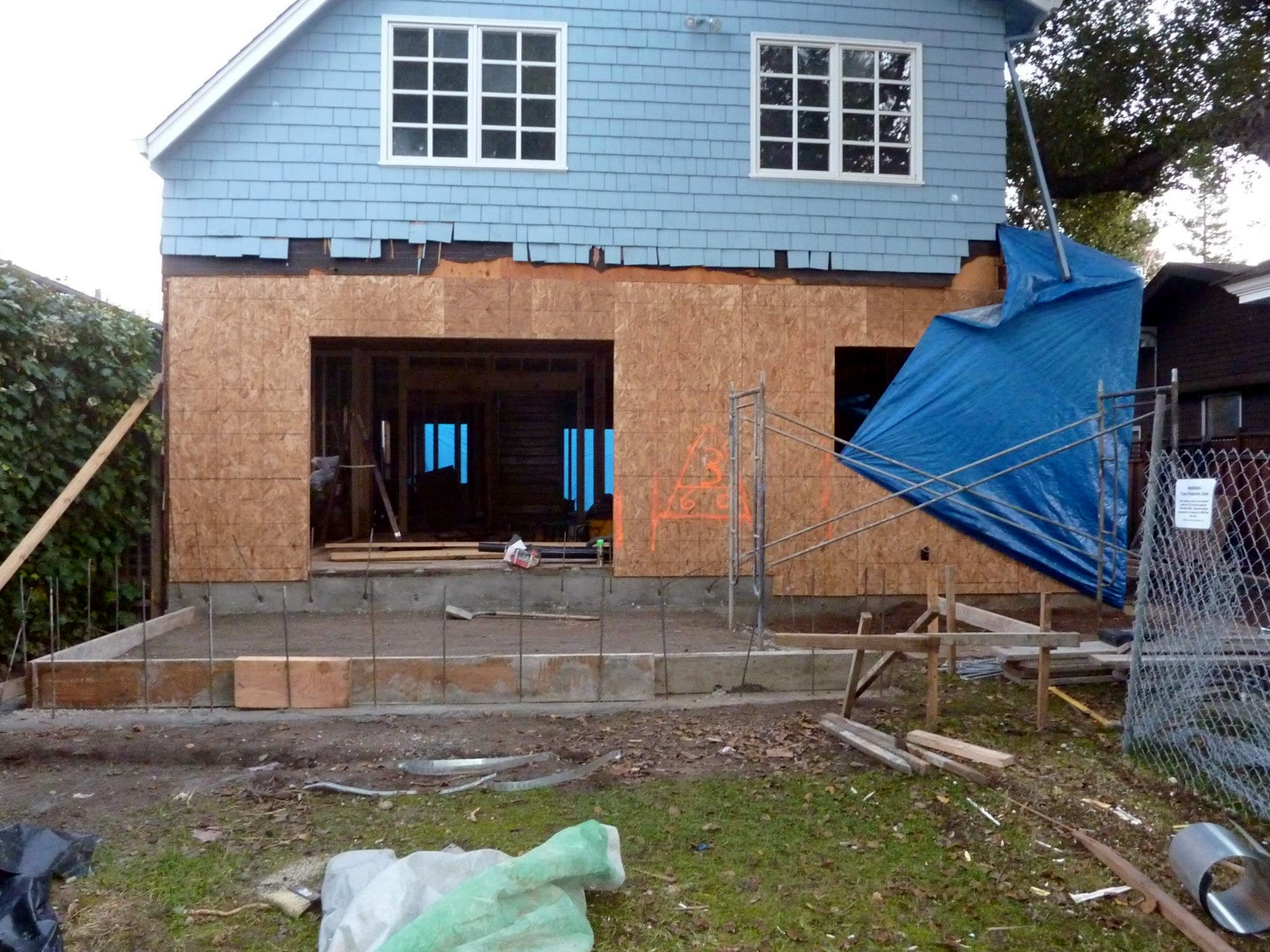 Rear wall of Family Room and Kitchen with the new foundation for the rear porch