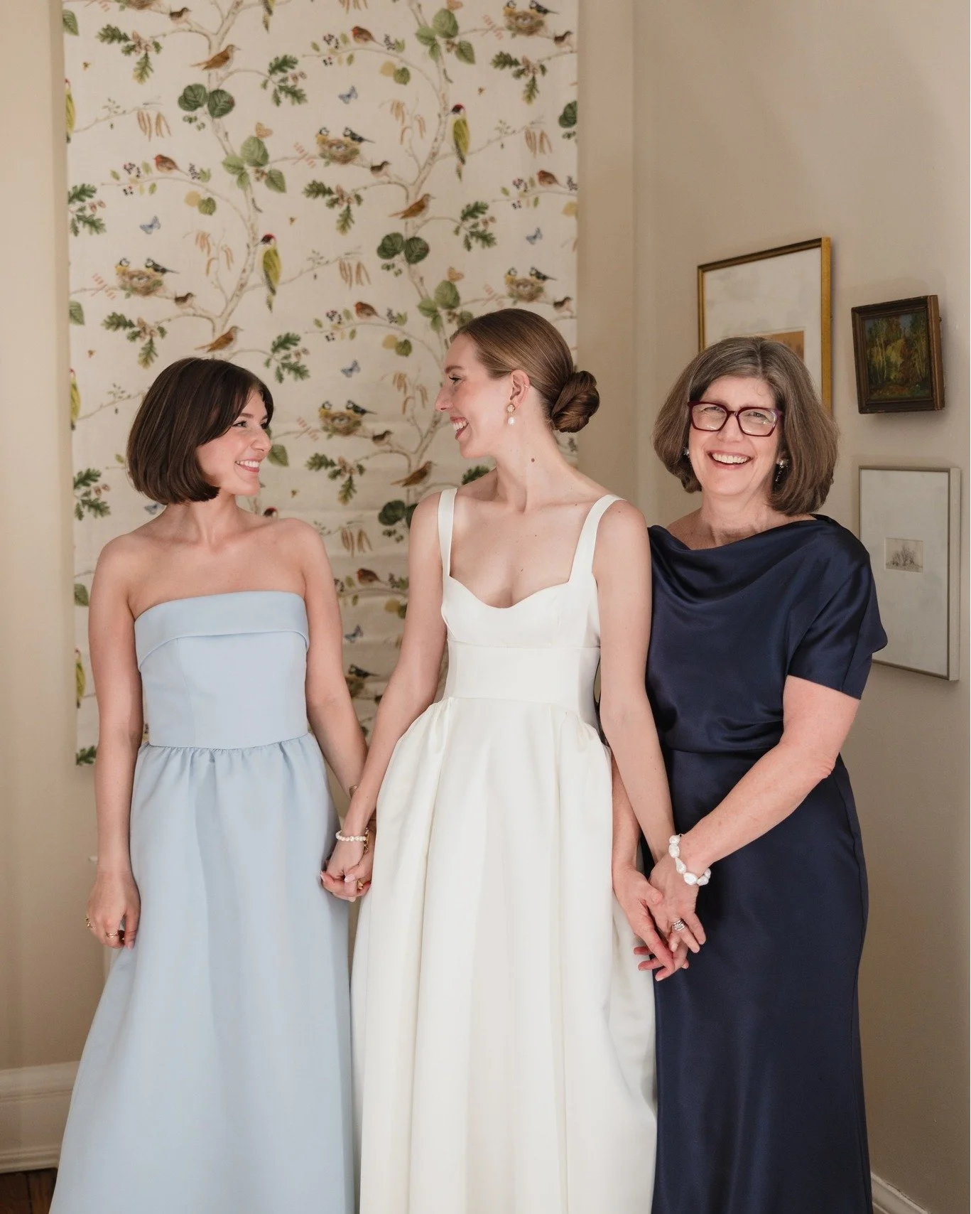 ✨ Laughter, happy tears, and the soft clinking of champagne flutes&mdash;this is where the magic begins. As Elizabeth's mom and sister carefully and cheerfully with excited 
hands help her along the getting ready process time is slowed to honor the q