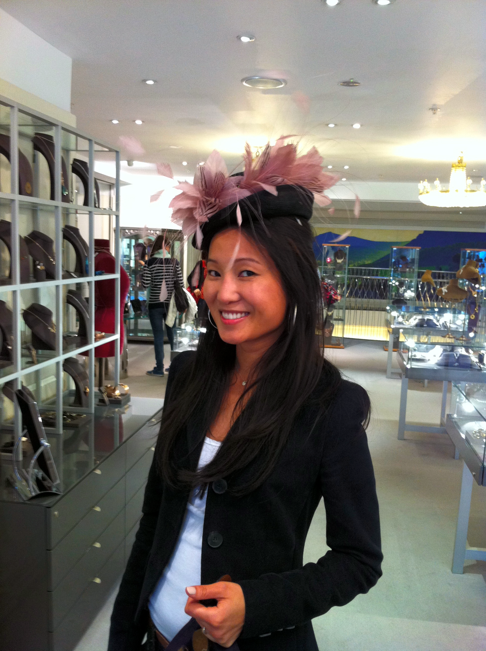 Trying on hats at Fortnum & Mason