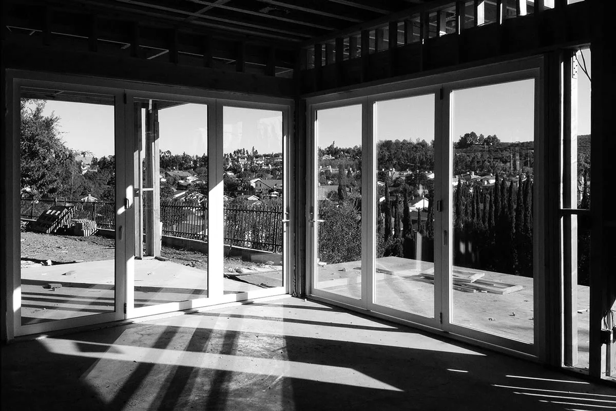 corner bi-folding door system