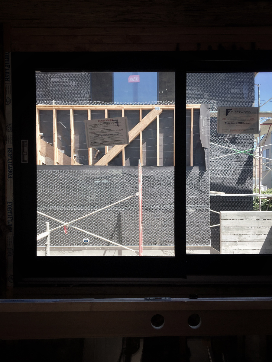 multislide window system at kitchen pass-thru