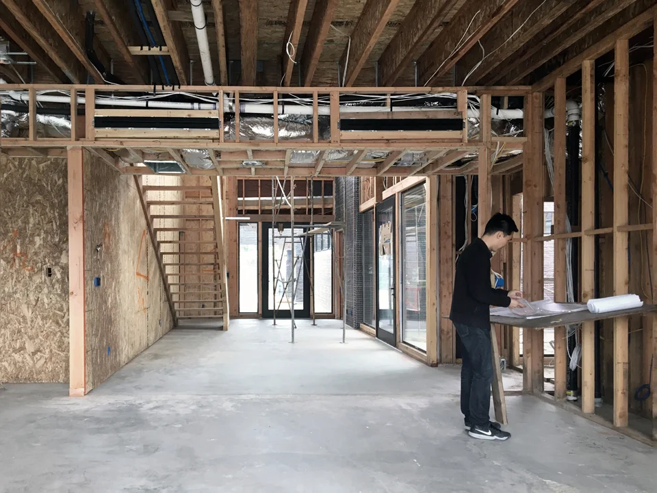 jason at the site / view toward entry from great room