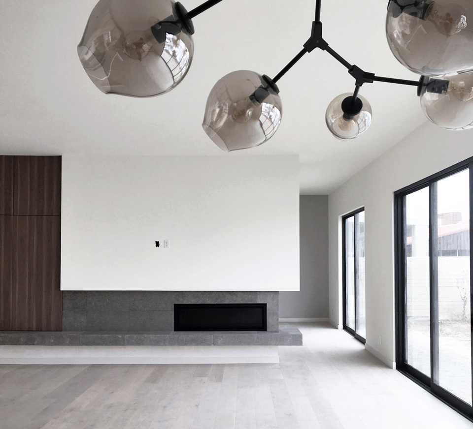 stone + cabinetry at asymmetrical fireplace