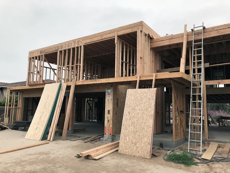 modernist massing / addition at entry + upper level