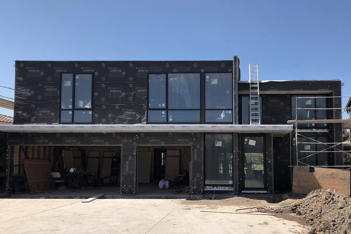 paper and lath - modern home under construction in huntington be
