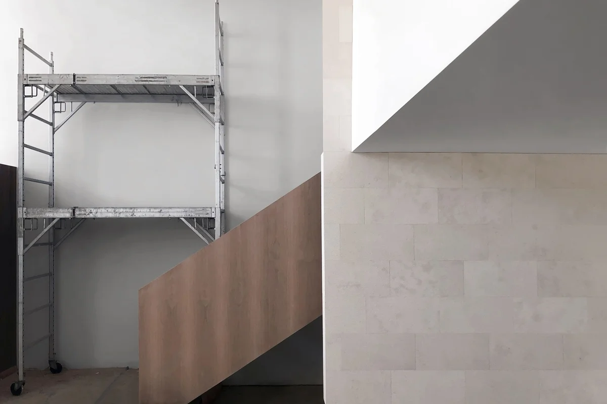 floating stair at limestone wall - under construction in hunting