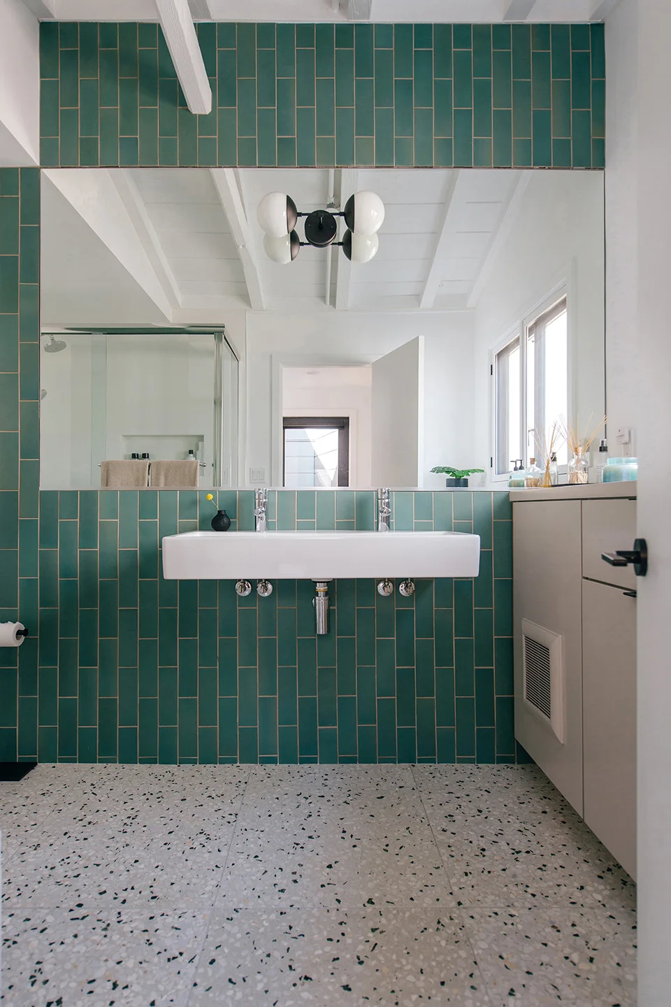 green heath wall tile + terrazzo flooring / secondary bath