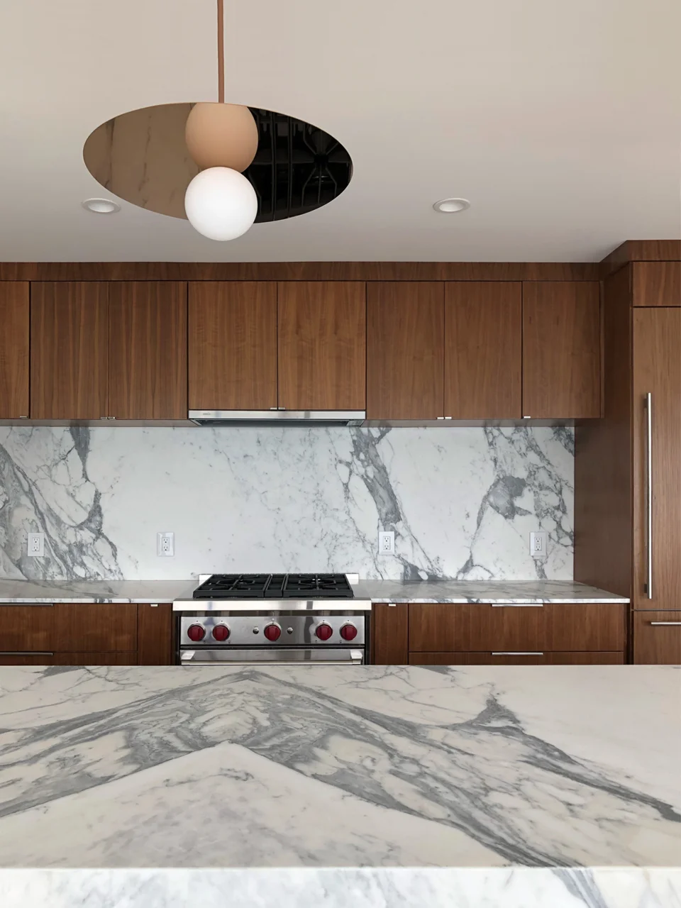 walnut, bookmatched marble + rose gold / kitchen island detail