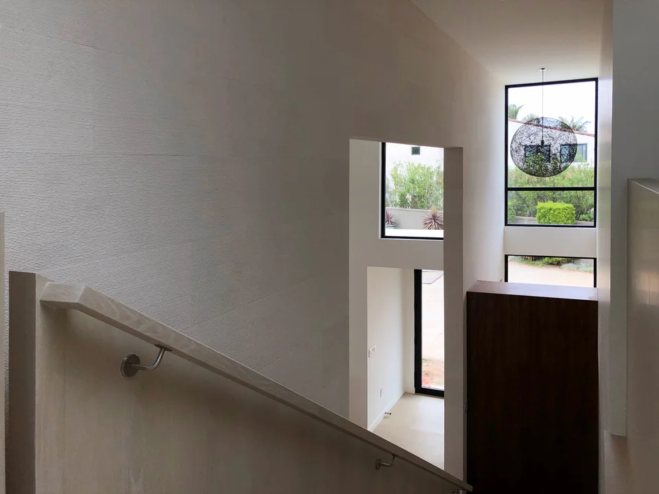 limestone + oak railing / view from upper landing