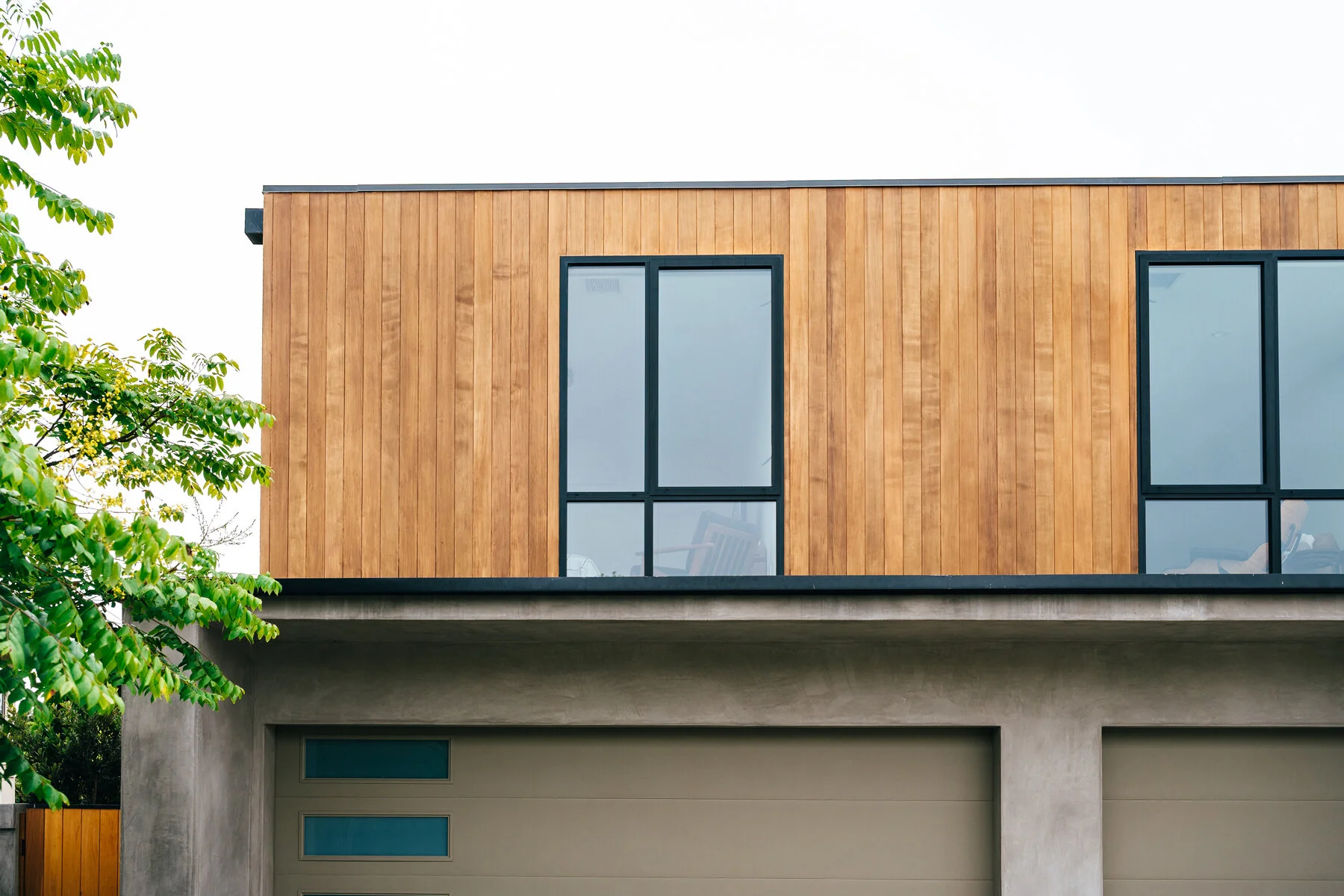 vertical cedar at flat roof addition