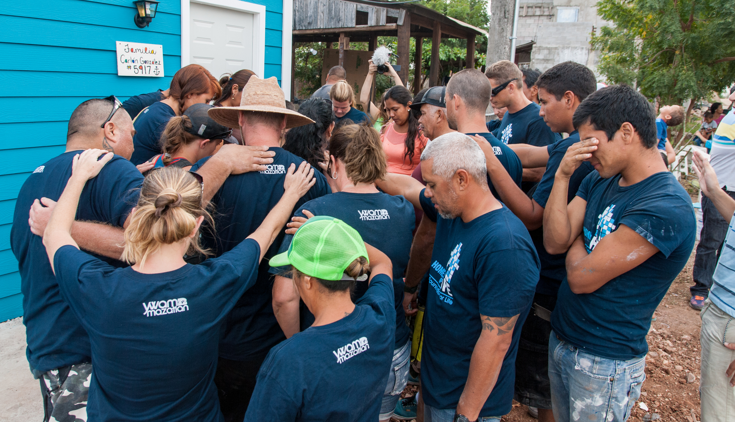 Praying for the family who received a home