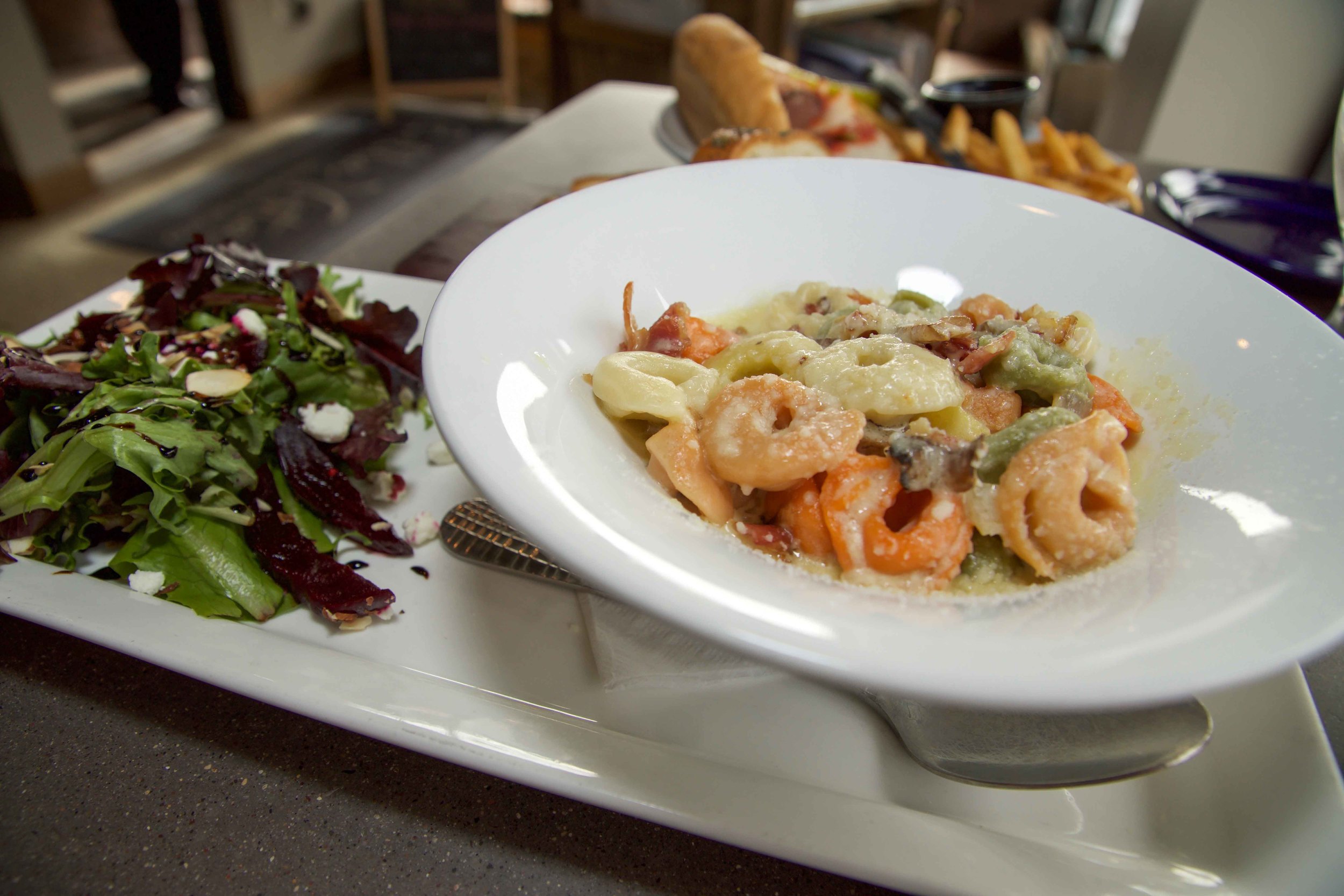 Tortellini (cheese tortellini with asiago cheese sauce, mushrooms and crispy pancetta) with Beet Salad (red and yellow beets, mixed field greens, goat cheese, almonds with a reduced balsamic)