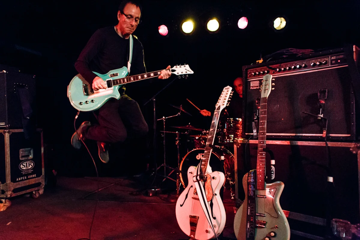 Wire guitarist Colin Newman catching some air at the Black Cat - 6/6/15 (photo by Matt Condon)