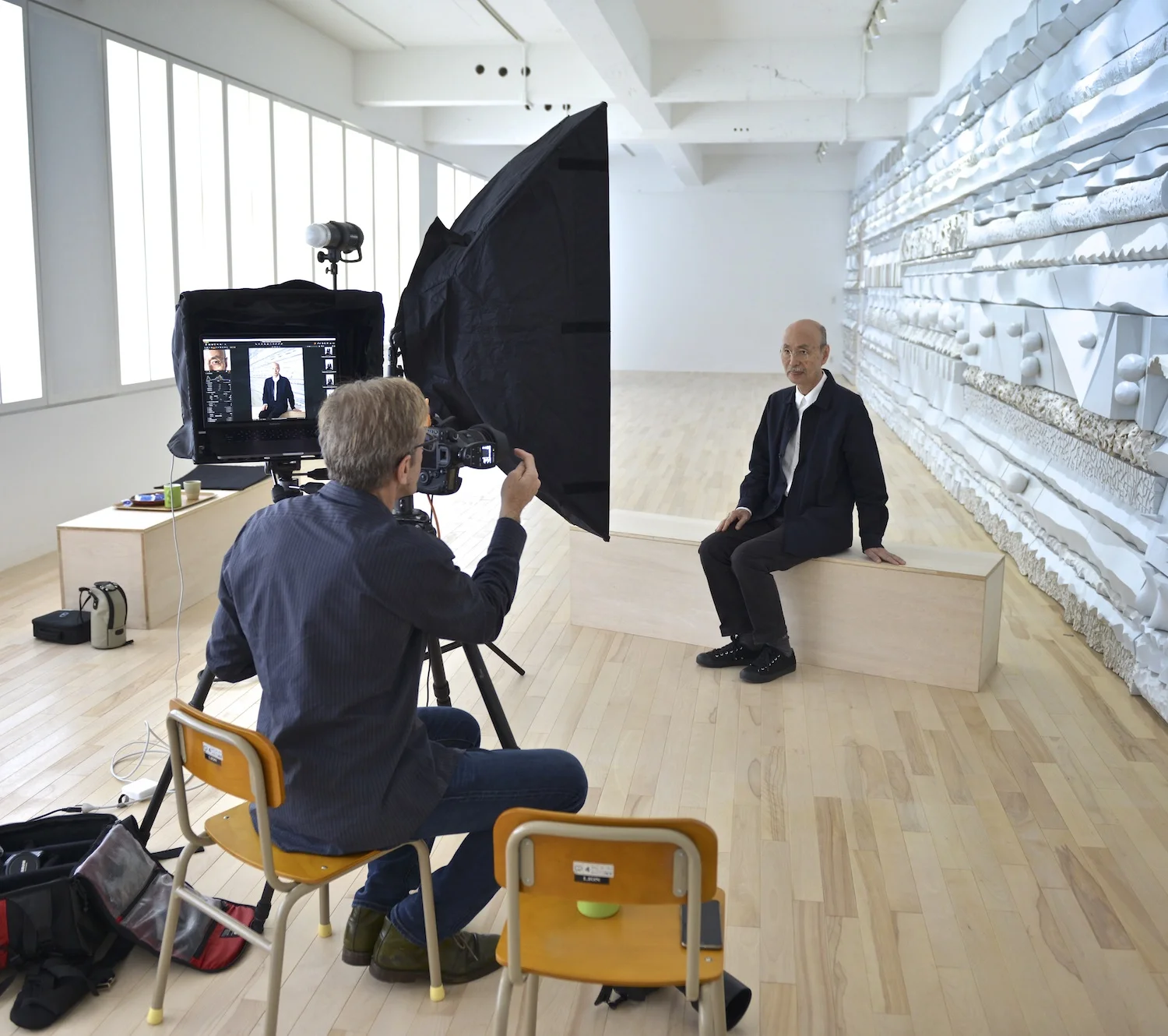Photographing Igarashi at the Kazenobi atalier+gallery in front of one of his terra cotta sculptures.