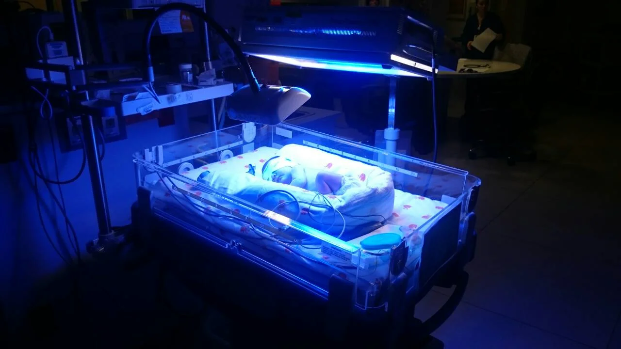 The fluorescent blue lights break down bilirubin.