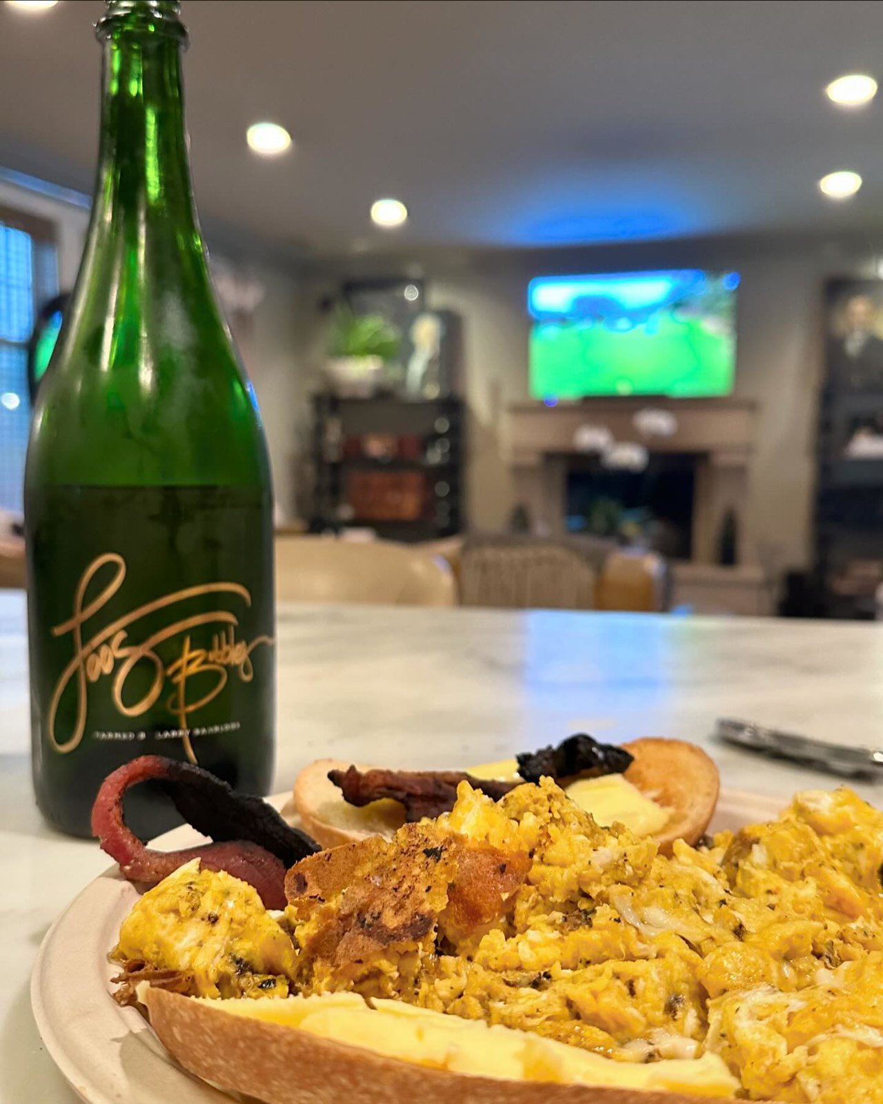 Sunday morning, coming down.  My wife is out of town.  My son slept at a friends house last night.  It’s raining outside.  I’m still in my PJs.  I made a garbage fire omelette I  popped a bottle of loos bubbles. I am watching @themasters  I lit a fire.