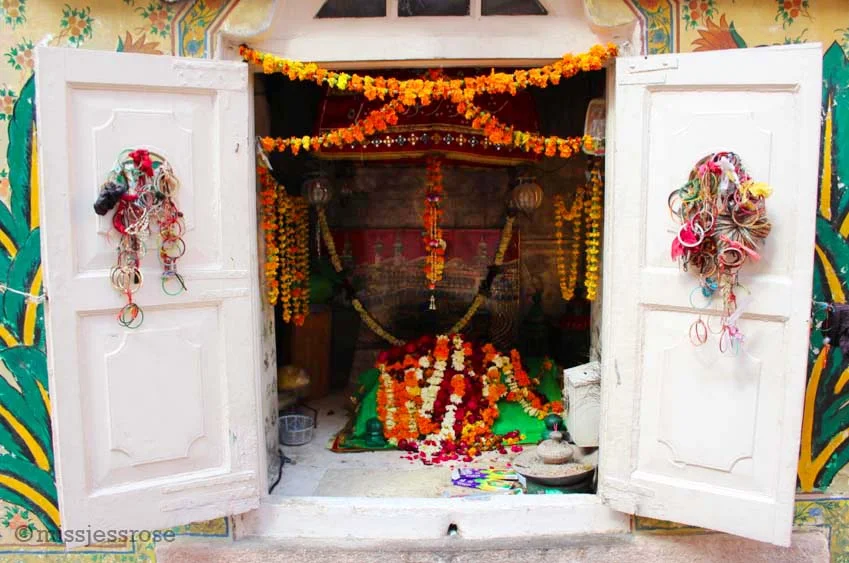 Small temple adorned with offerings