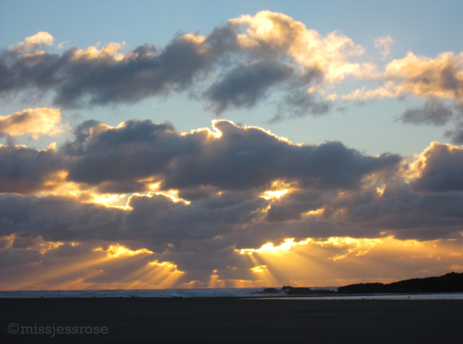 We arrived at Karekare beach just in time to see the sun bleeding through the clouds. Waves rolled in, white and foamy, reflecting the soft dazzling rays of sunlight as the clouds diffused their shine. This is the beach where The Piano was filmed, and amidst the overpowering beauty of the Earth's elements, there was also a moody feeling of both romance and the gentle but constant reminder of Mother Nature's power.