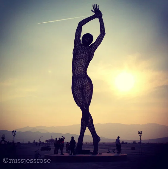 Beautiful woman made of steel mesh with some 3,000 LED lights inside for a lovely show at night