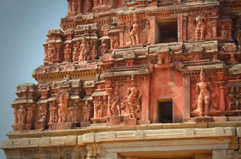 Exterior of one of dozens of elaborately carved ancient stone structures at Vittala temple